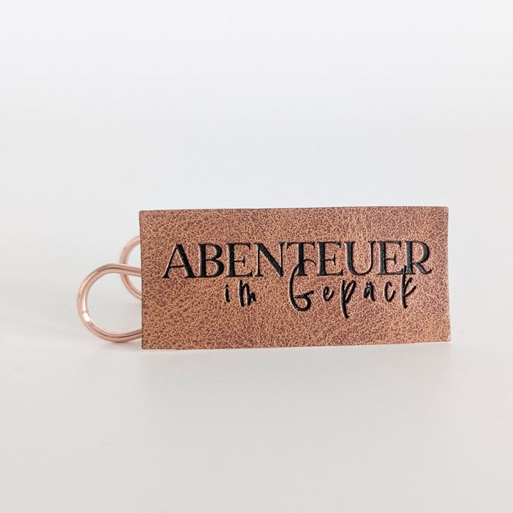 Kunstlederlabel "Abenteuer im Gepäck"