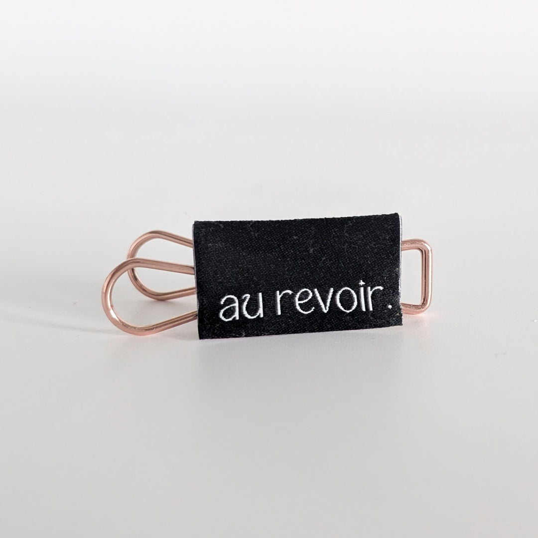 Weblabel schwarz "au revoir"
