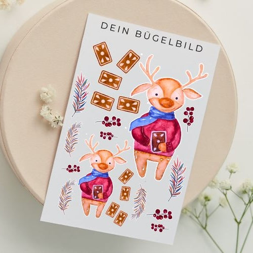 Bügelbild mit Rentier, Lebkuchen und Beeren im Transferdruck – ideal für winterliche DIY-Projekte und Kinderkleidung
