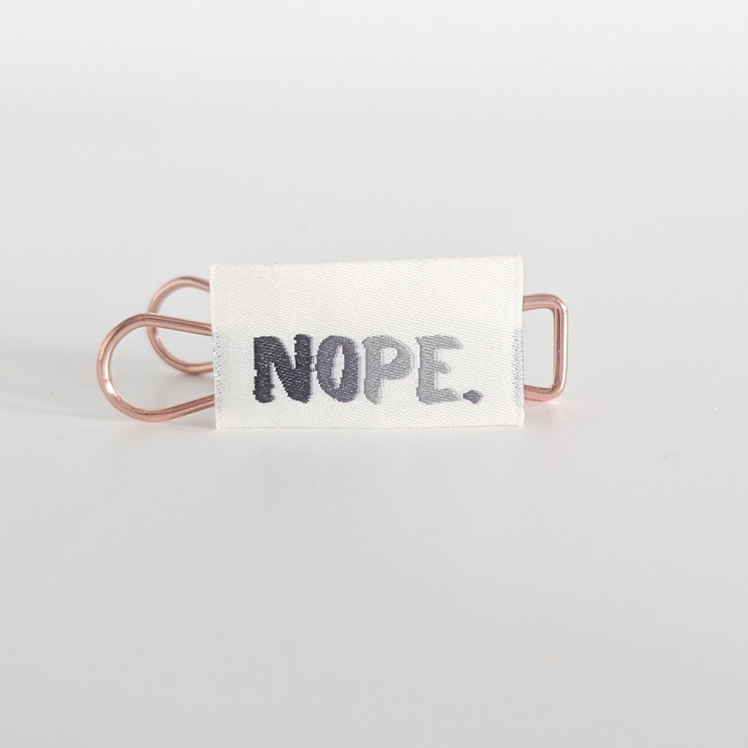 Weblabel "Nope" (grau)